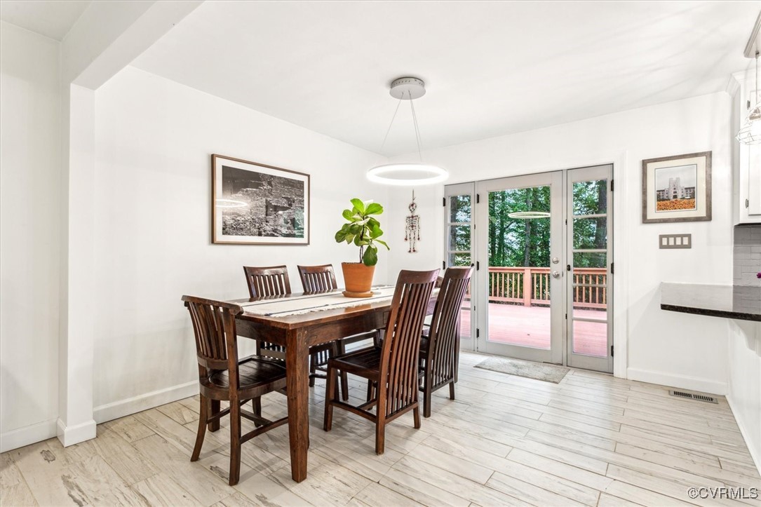 2102 Jolly Pond Road Williamsburg, VA 23188 - Photo 2 of 3 a view of a dining room with furniture window and wooden floor