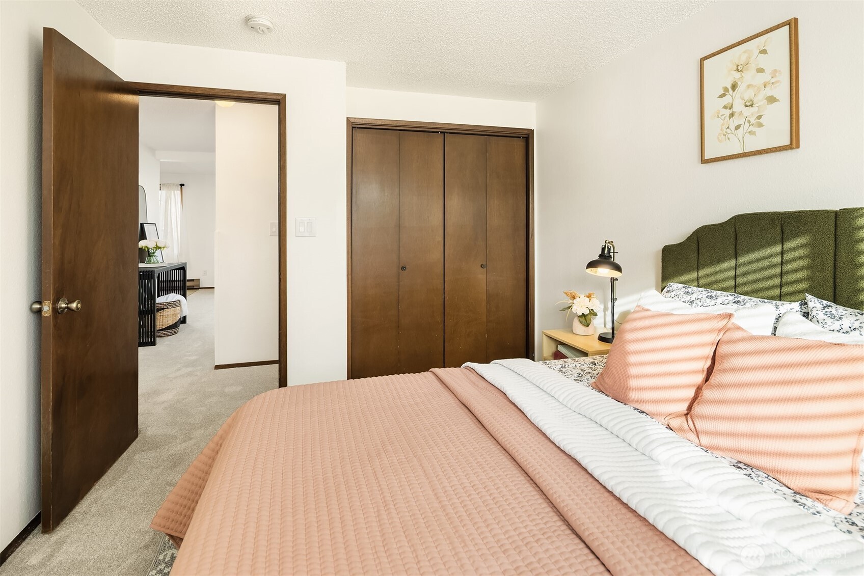 1612 33rd Street, Unit 104 Everett, WA 98201 - Photo 16 of 24 a bedroom with a bed and a walk in closet