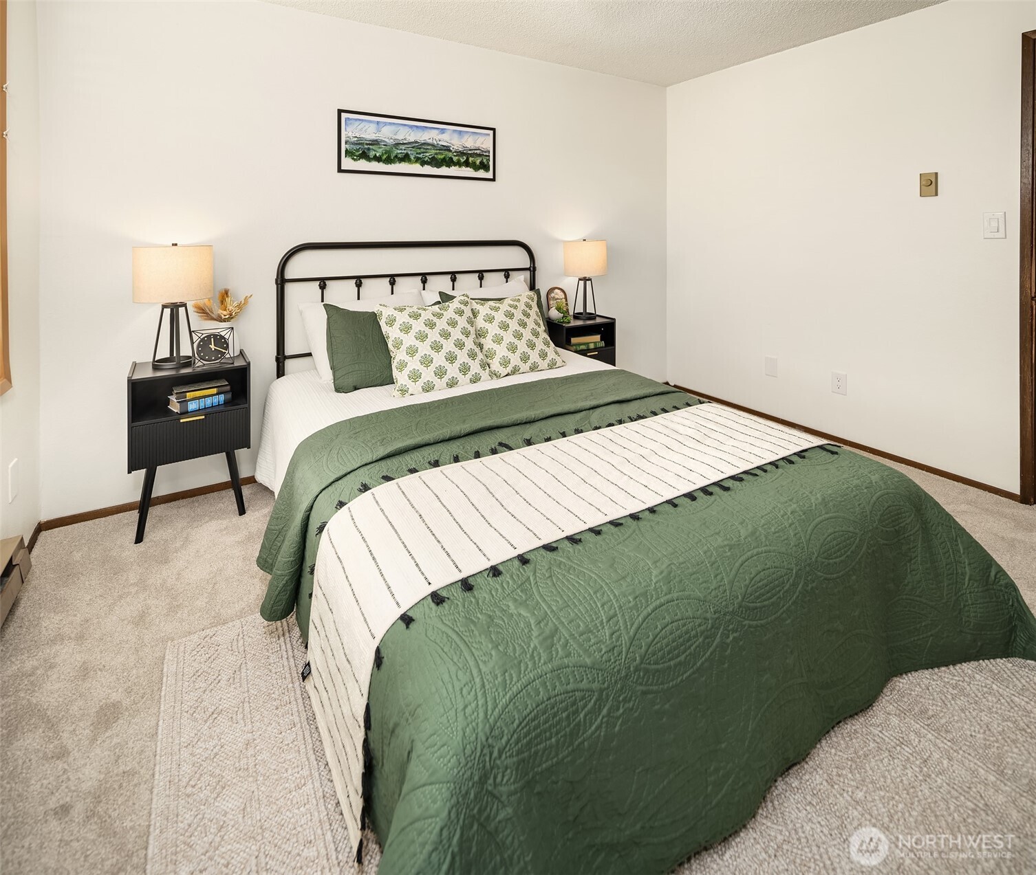 1612 33rd Street, Unit 104 Everett, WA 98201 - Photo 17 of 24 a bedroom with a bed and a painting on the wall
