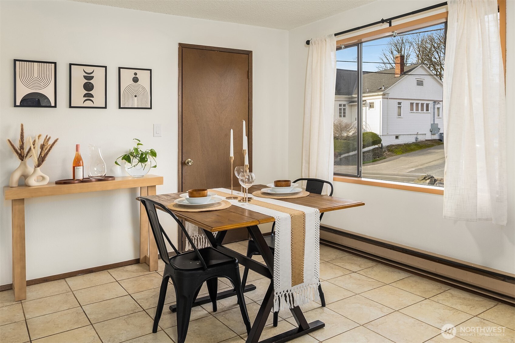 1612 33rd Street, Unit 104 Everett, WA 98201 - Photo 9 of 24 a view of a dining room with furniture and a large window
