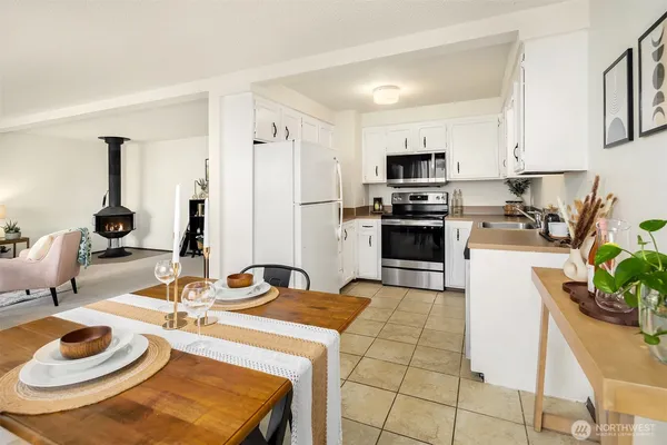 a kitchen with a sink appliances and cabinets