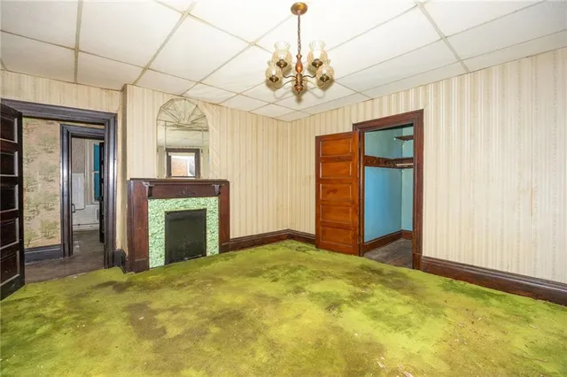 a view of a livingroom with wooden floor and a window