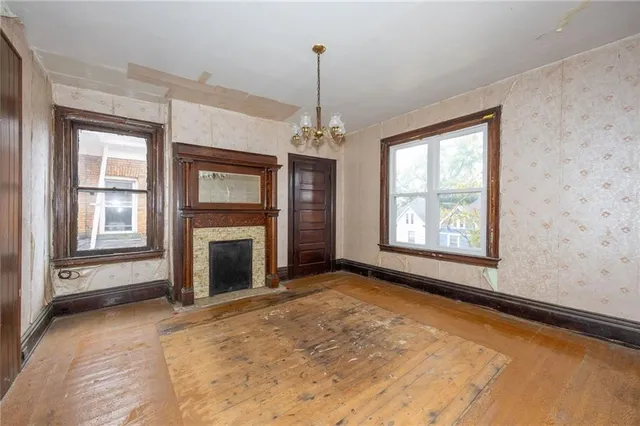 a view of a room with a window and a ceiling fan