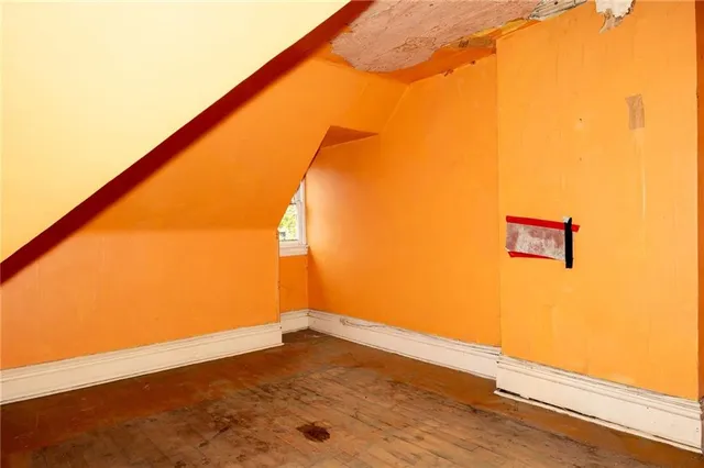 a front view of a house with plants