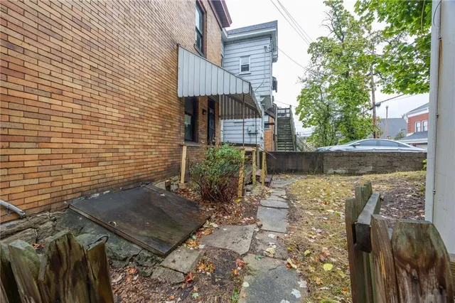 a backyard of a house with lots of green space