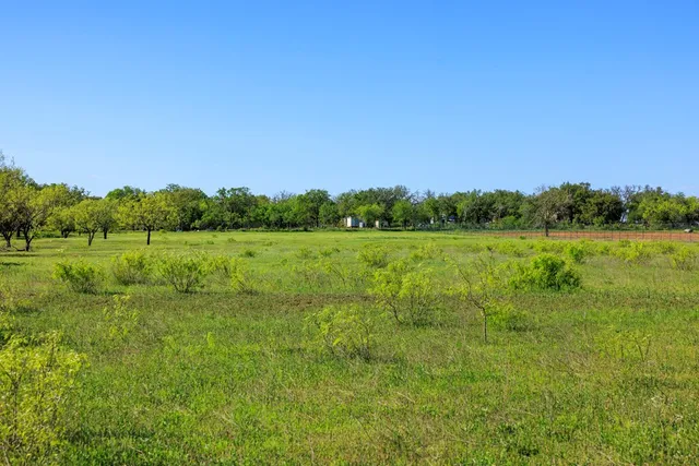 a view of a lake with a big yard