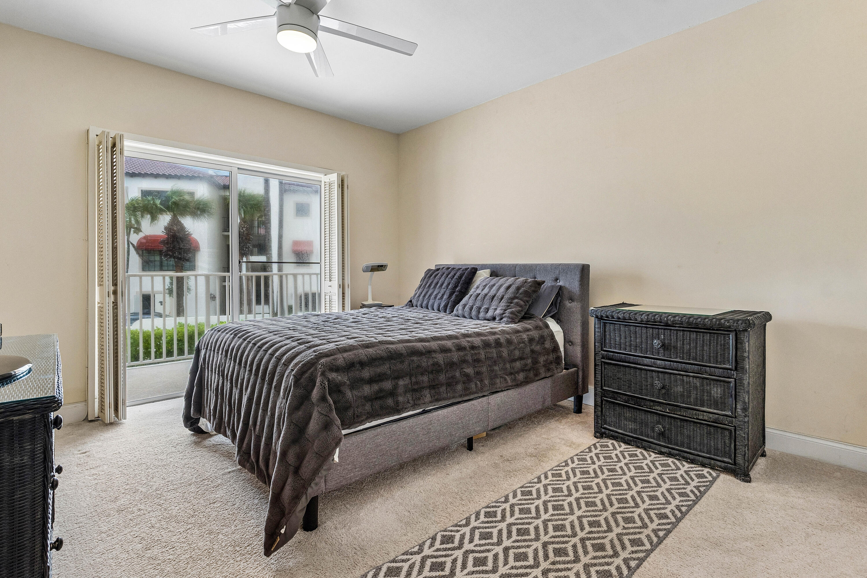 5900 Old Ocean Boulevard, Unit C5 Ocean Ridge, FL 33435 - Photo 11 of 17 a bedroom with a bed and a window