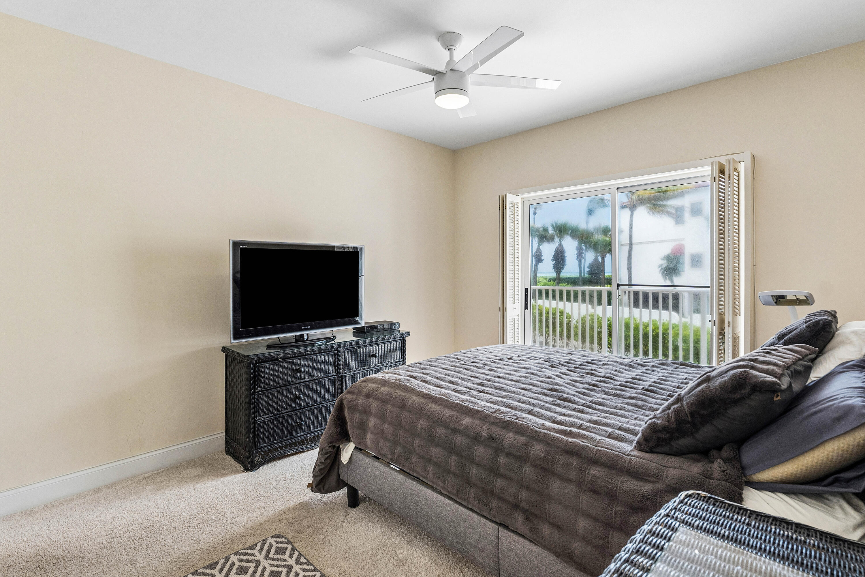 5900 Old Ocean Boulevard, Unit C5 Ocean Ridge, FL 33435 - Photo 12 of 17 a bedroom with a bed and a television