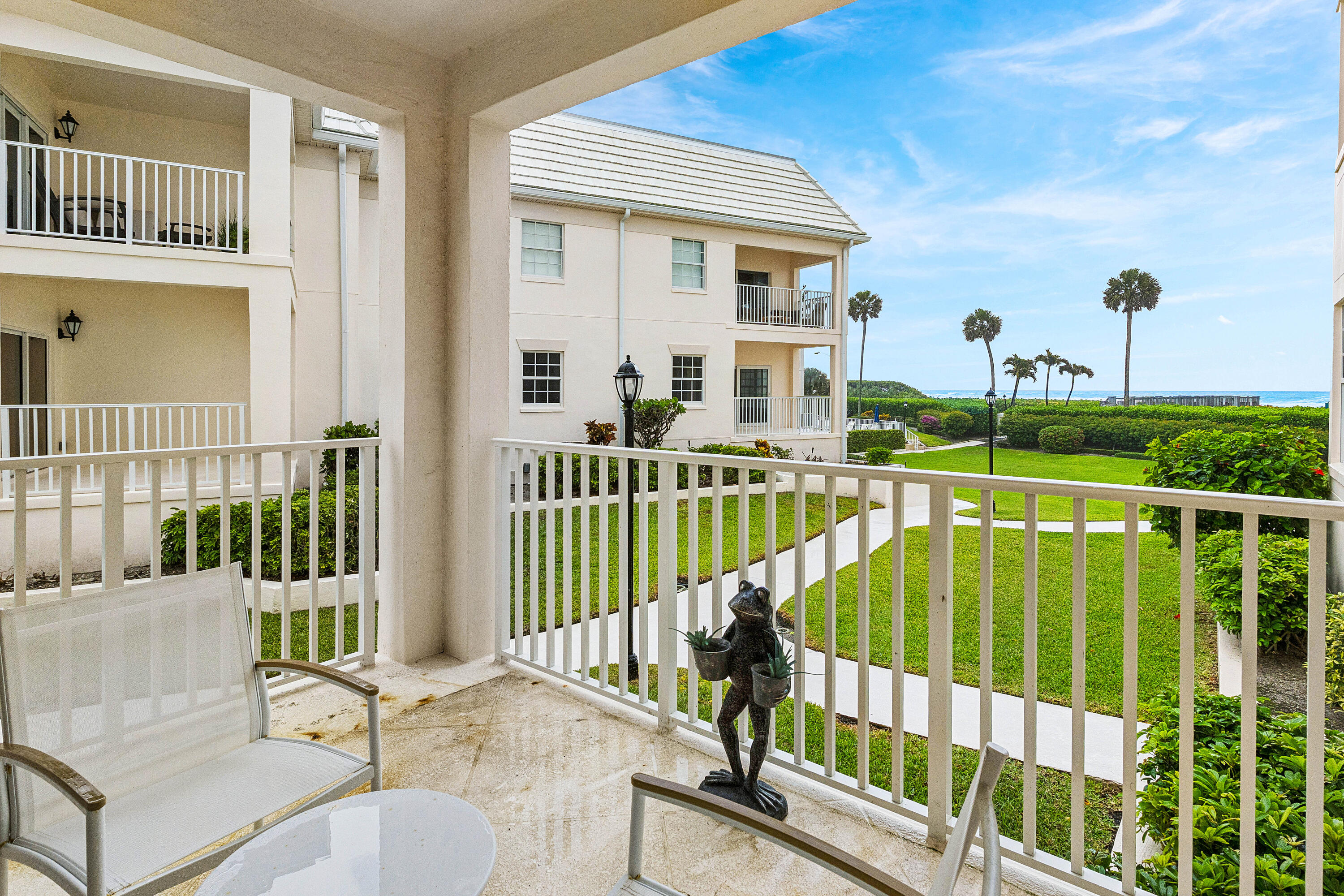 5900 Old Ocean Boulevard, Unit C5 Ocean Ridge, FL 33435 - Photo 14 of 17 a view of a balcony with two chairs