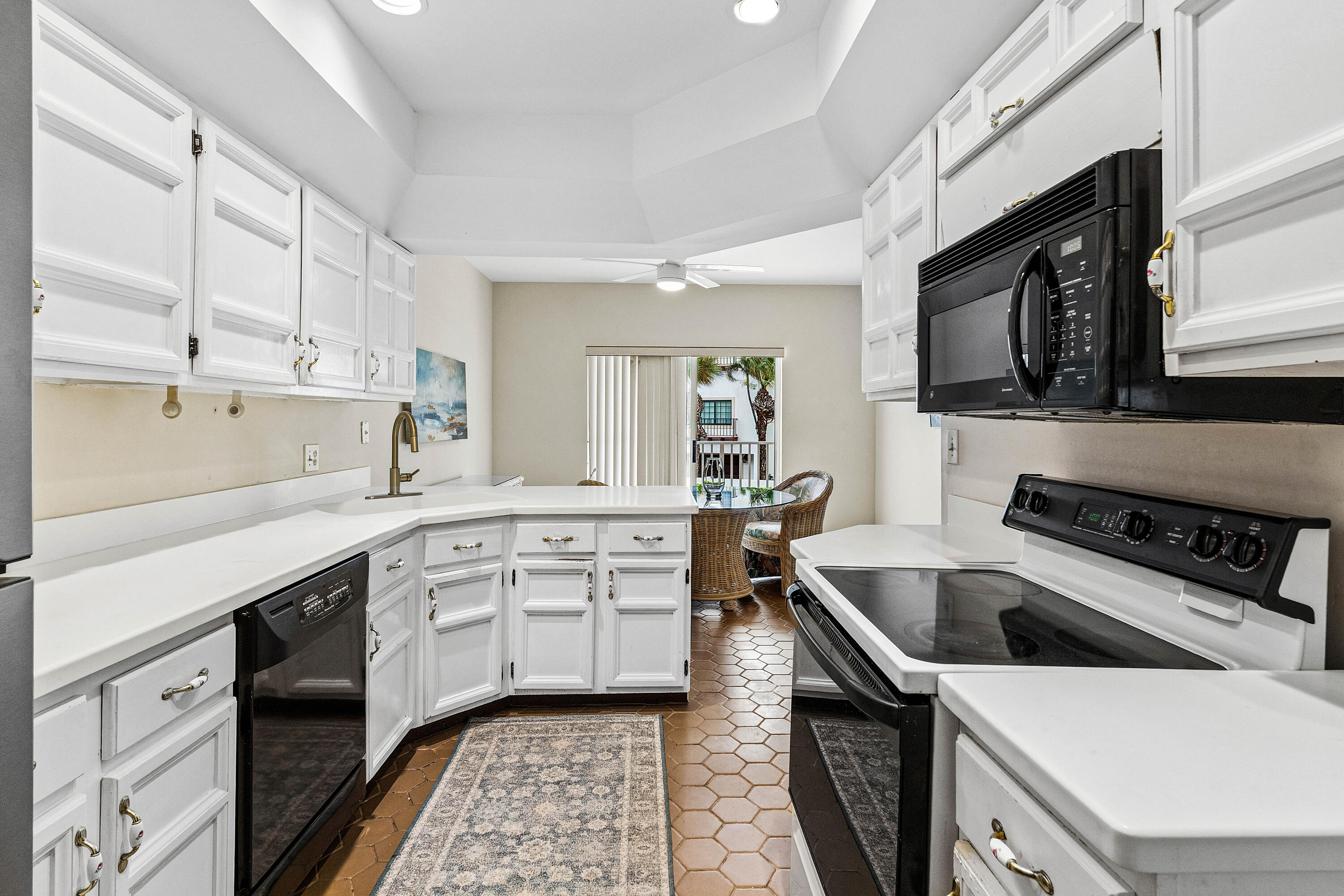 5900 Old Ocean Boulevard, Unit C5 Ocean Ridge, FL 33435 - Photo 5 of 17 a kitchen with a sink stove and microwave