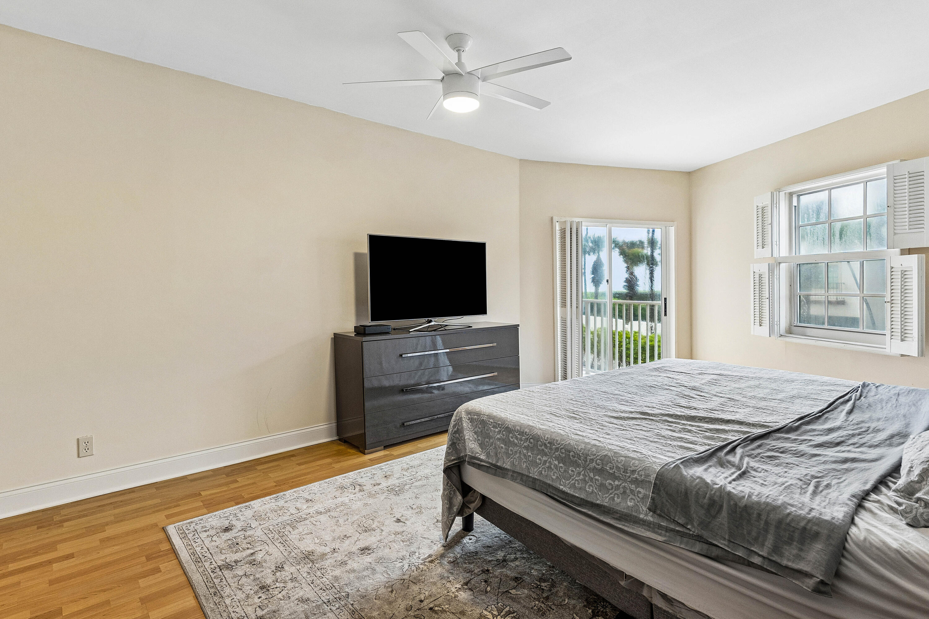 5900 Old Ocean Boulevard, Unit C5 Ocean Ridge, FL 33435 - Photo 8 of 17 a bedroom with a bed and a flat screen tv