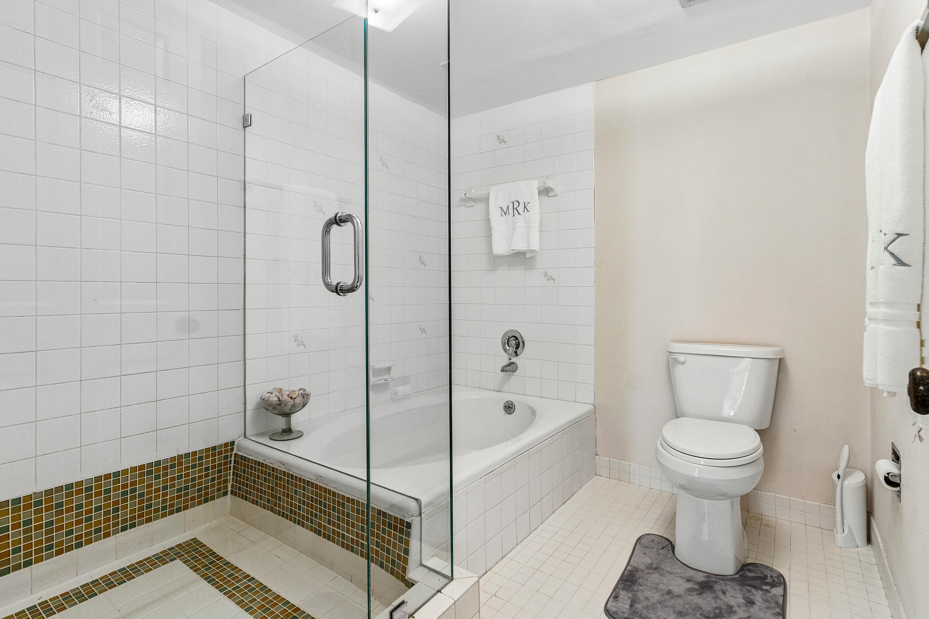 5900 Old Ocean Boulevard, Unit C5 Ocean Ridge, FL 33435 - Photo 10 of 17 a bathroom with a toilet and a shower