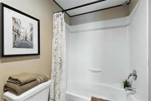 a bathroom with a shower and a bathtub