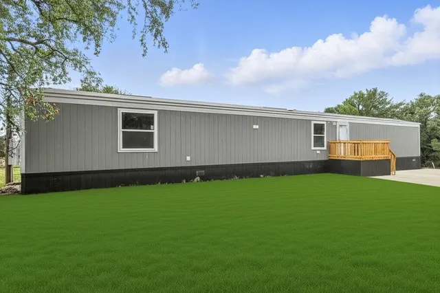 a backyard of a house with lots of green space