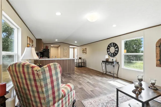 a living room with furniture and a window