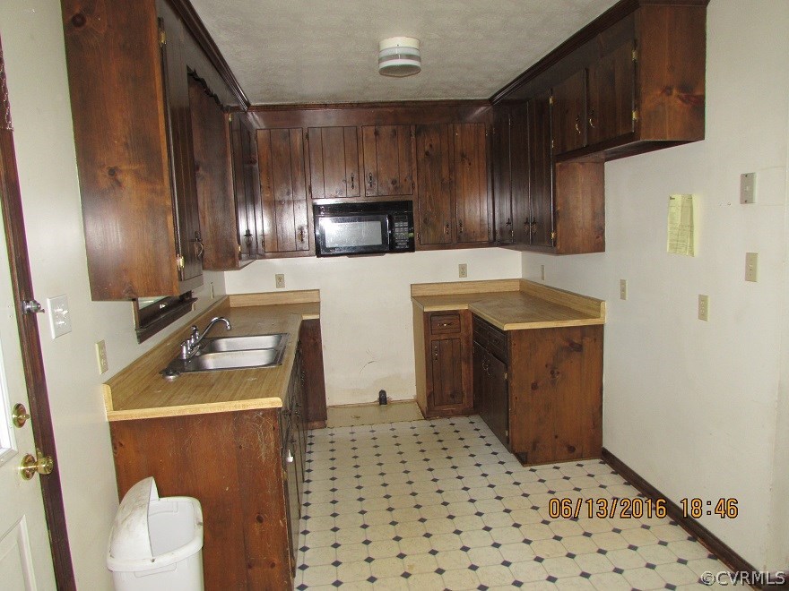 660 Cooks Road Farmville, VA 23901 - Photo 16 of 18 a kitchen with a sink refrigerator and cabinets