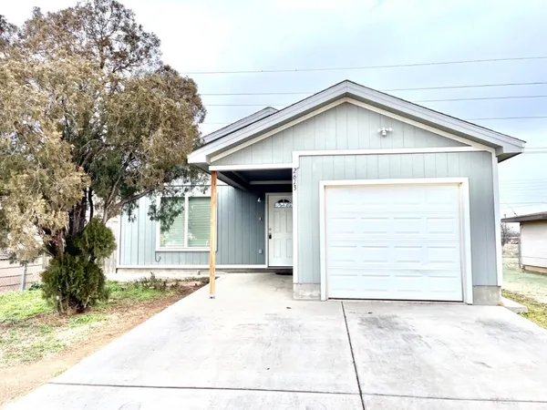 a view of house with garage
