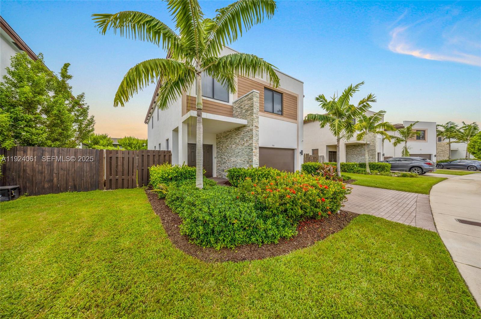 268 Northeast 210th Way Miami, FL 33179 - Photo 3 of 98 a view of a palm trees in front of house