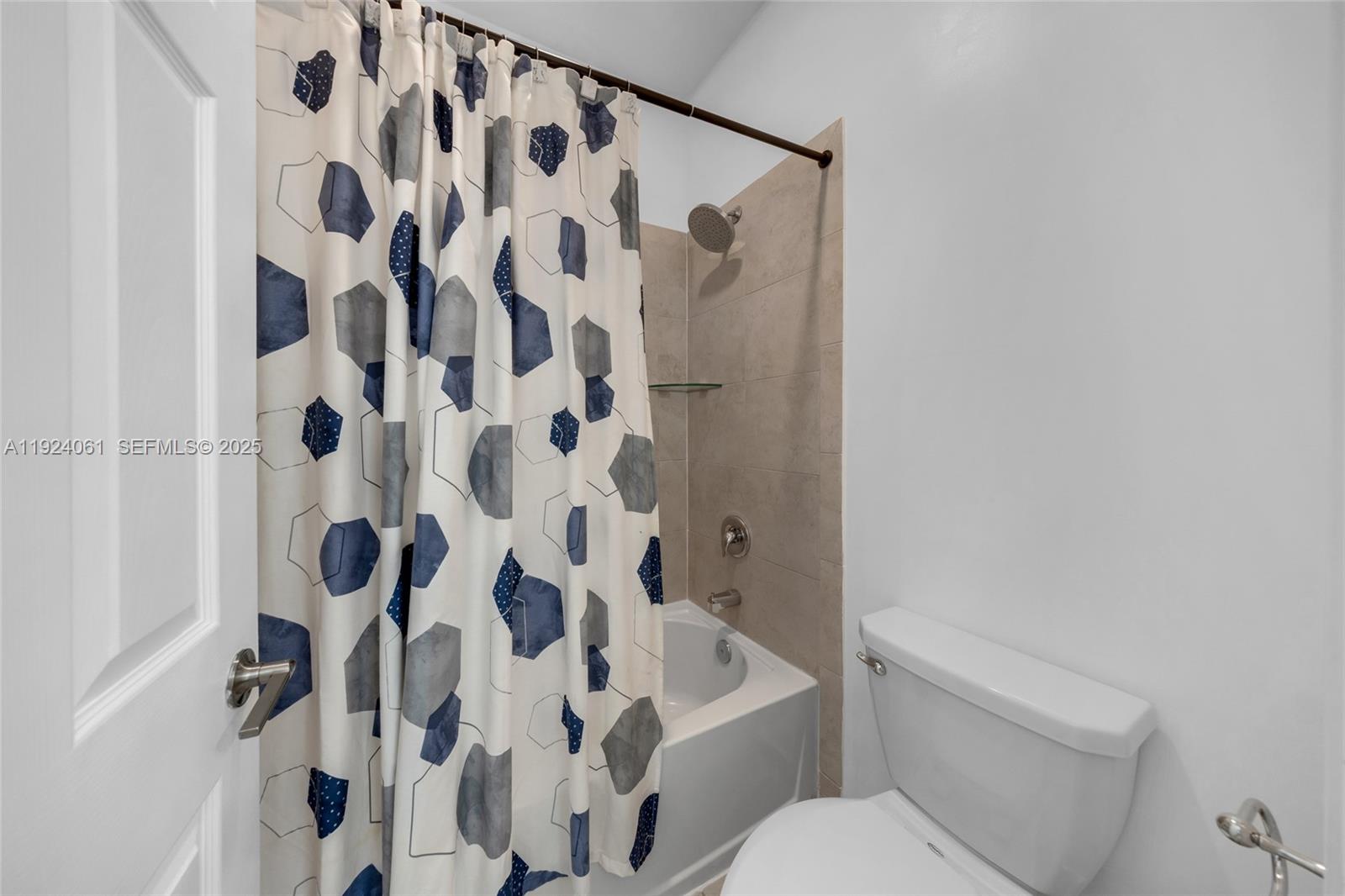 268 Northeast 210th Way Miami, FL 33179 - Photo 36 of 98 a white toilet sitting next to a white curtain