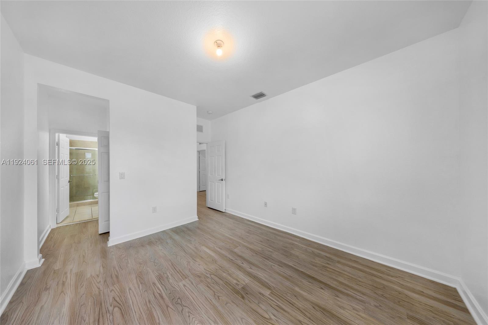 268 Northeast 210th Way Miami, FL 33179 - Photo 49 of 98 wooden floor in an empty room