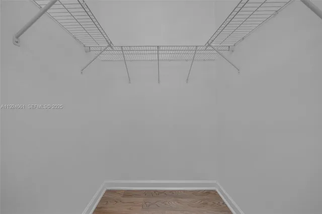 an aerial view of residential houses with outdoor space and street view