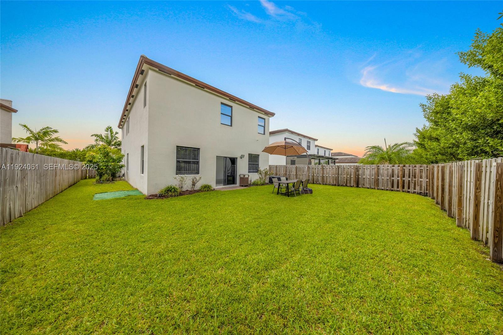 268 Northeast 210th Way Miami, FL 33179 - Photo 56 of 98 a view of a house with backyard and garden
