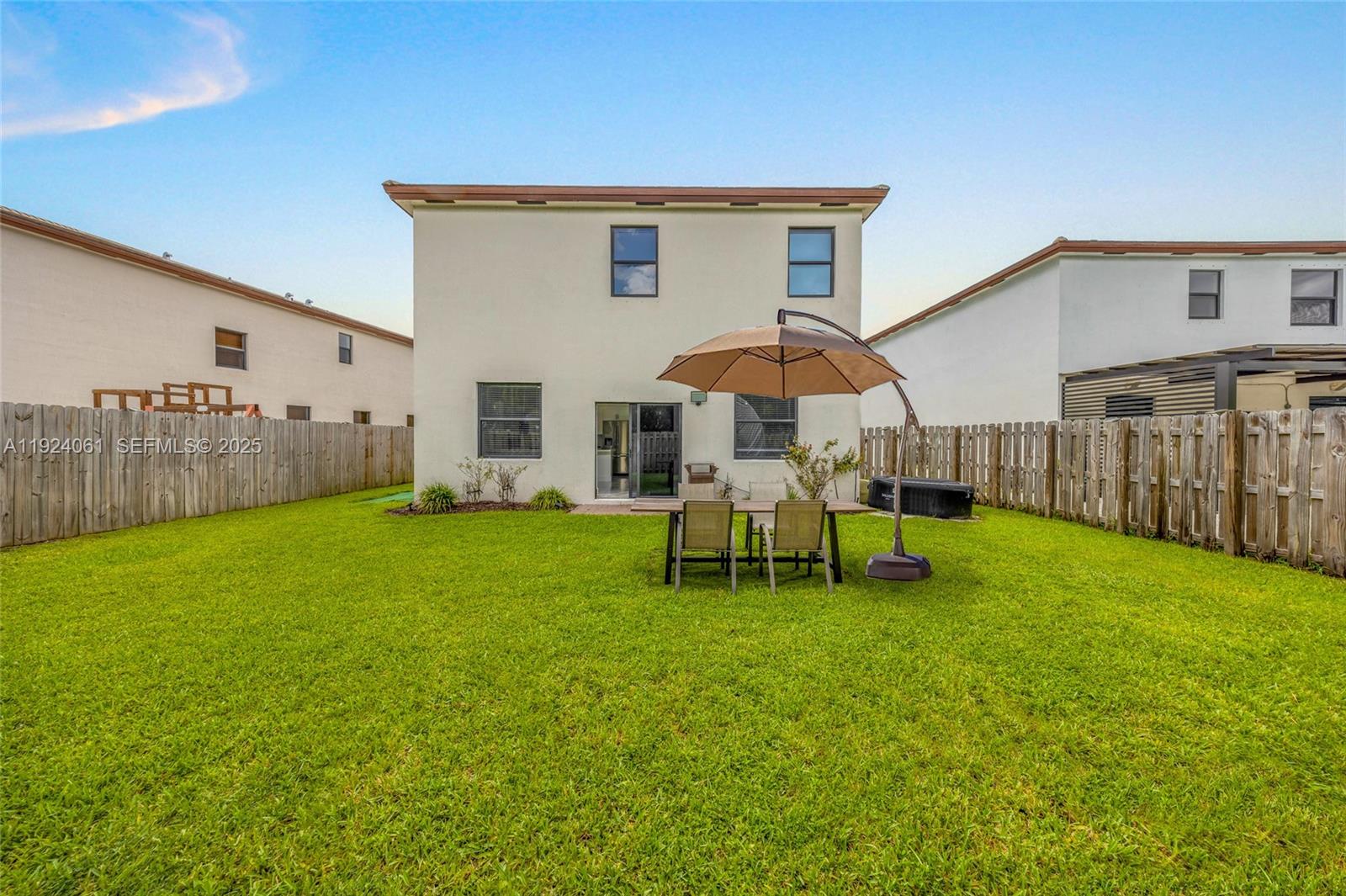 268 Northeast 210th Way Miami, FL 33179 - Photo 58 of 98 a view of a house with backyard and sitting area