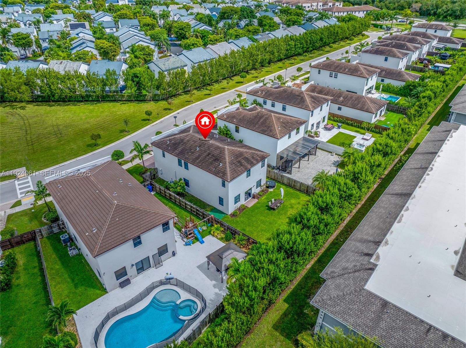268 Northeast 210th Way Miami, FL 33179 - Photo 88 of 98 an aerial view of a house with a garden and lake view