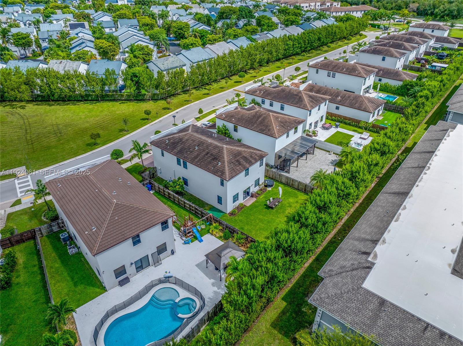 268 Northeast 210th Way Miami, FL 33179 - Photo 89 of 98 an aerial view of a house with a garden and lake view