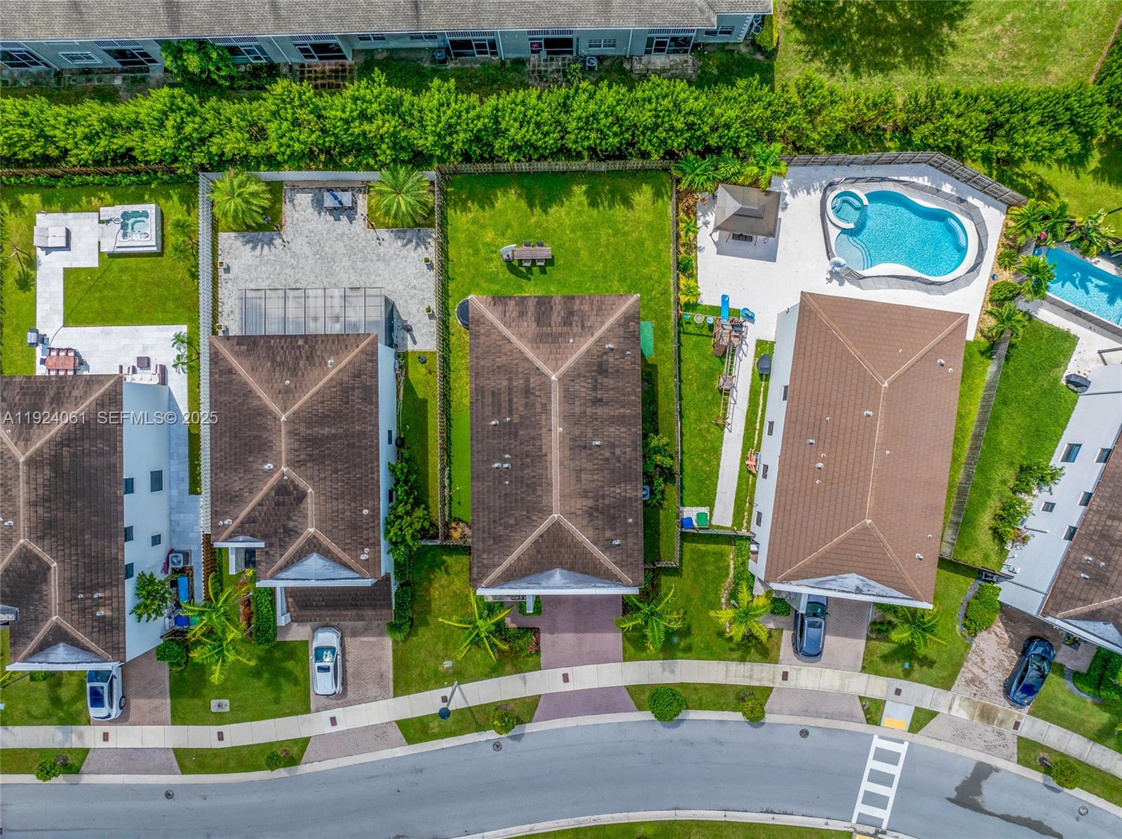 268 Northeast 210th Way Miami, FL 33179 - Photo 93 of 98 an aerial view of a house with a garden and plants