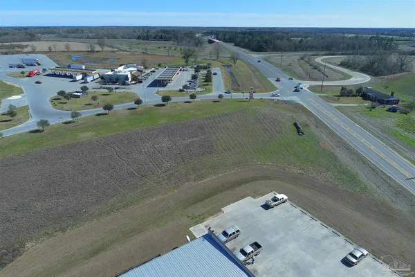 an aerial view of a house with outdoor space
