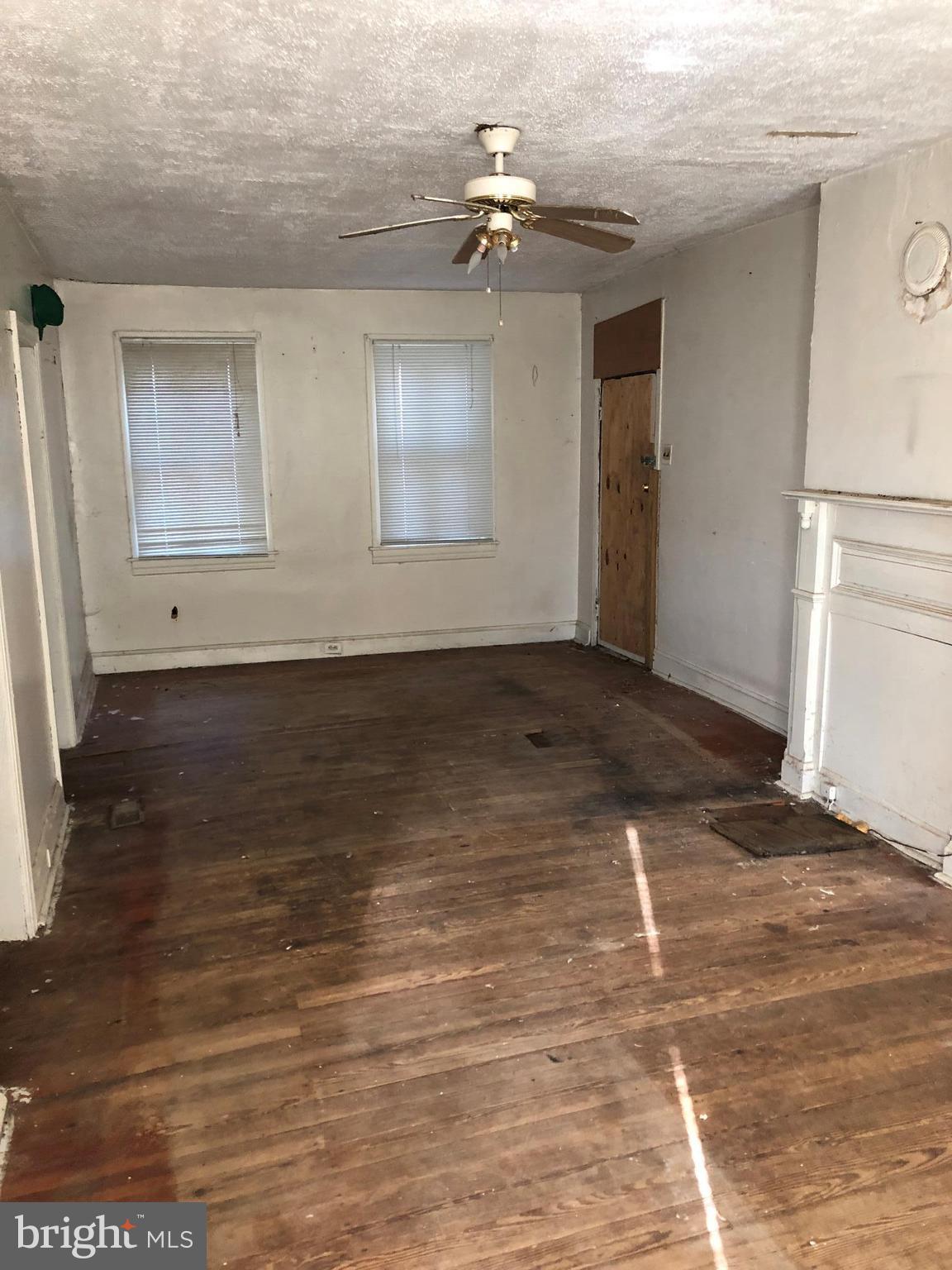 21005 Reno Monument Road Boonsboro, MD 21713 - Photo 17 of 30 an empty room with wooden floor and a hallway