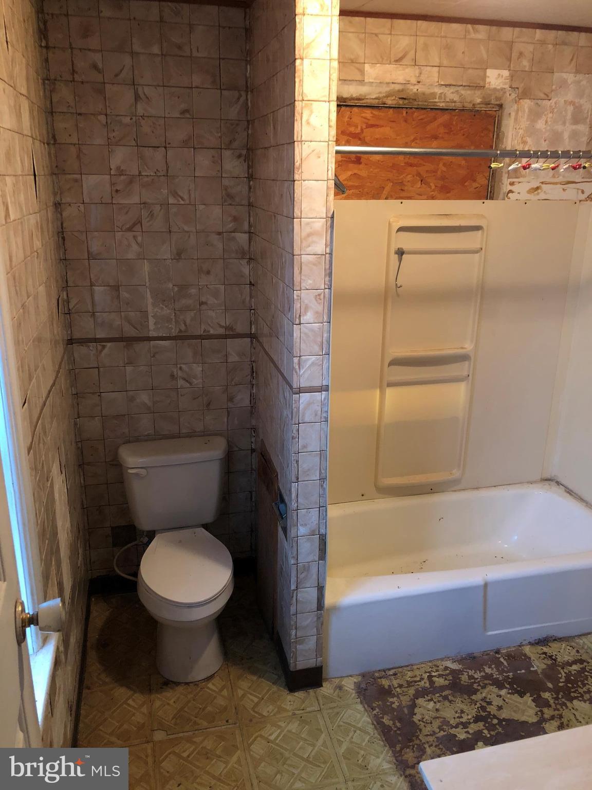21005 Reno Monument Road Boonsboro, MD 21713 - Photo 24 of 30 a bathroom with a toilet and a shower