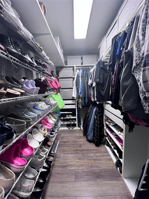 3300 Bridge Road Cooper City, FL 33026 - Photo 14 of 30 a view of walk in closet with clothes and shoes