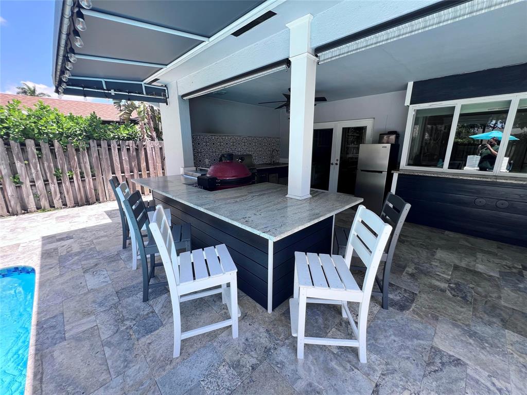 3300 Bridge Road Cooper City, FL 33026 - Photo 24 of 30 a view of a chairs and table in the patio