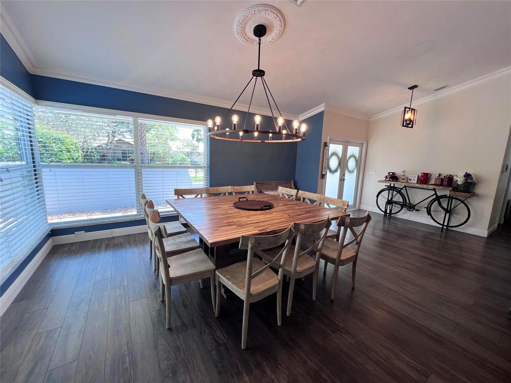 3300 Bridge Road Cooper City, FL 33026 - Photo 29 of 30 a view of a dining room with furniture wooden floor and chandelier