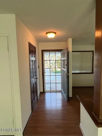 a view of entryway with wooden floor