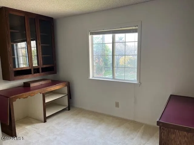 a room with furniture and window