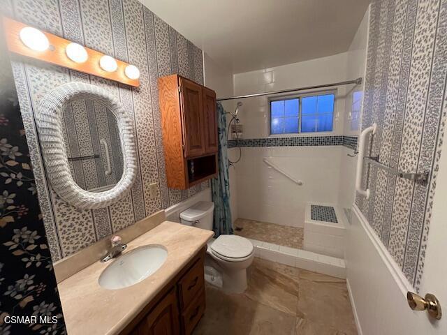 2675 Lembert Street Simi Valley, CA 93065 - Photo 7 of 30 a bathroom with a sink a toilet and a mirror