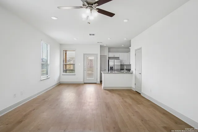 a view of kitchen with sink and wooden floor