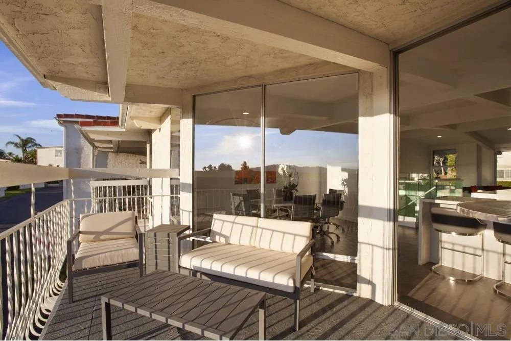 2331 Caringa Way, Unit 38 Carlsbad, CA 92009 - Photo 11 of 26 a view of a balcony with wooden floor