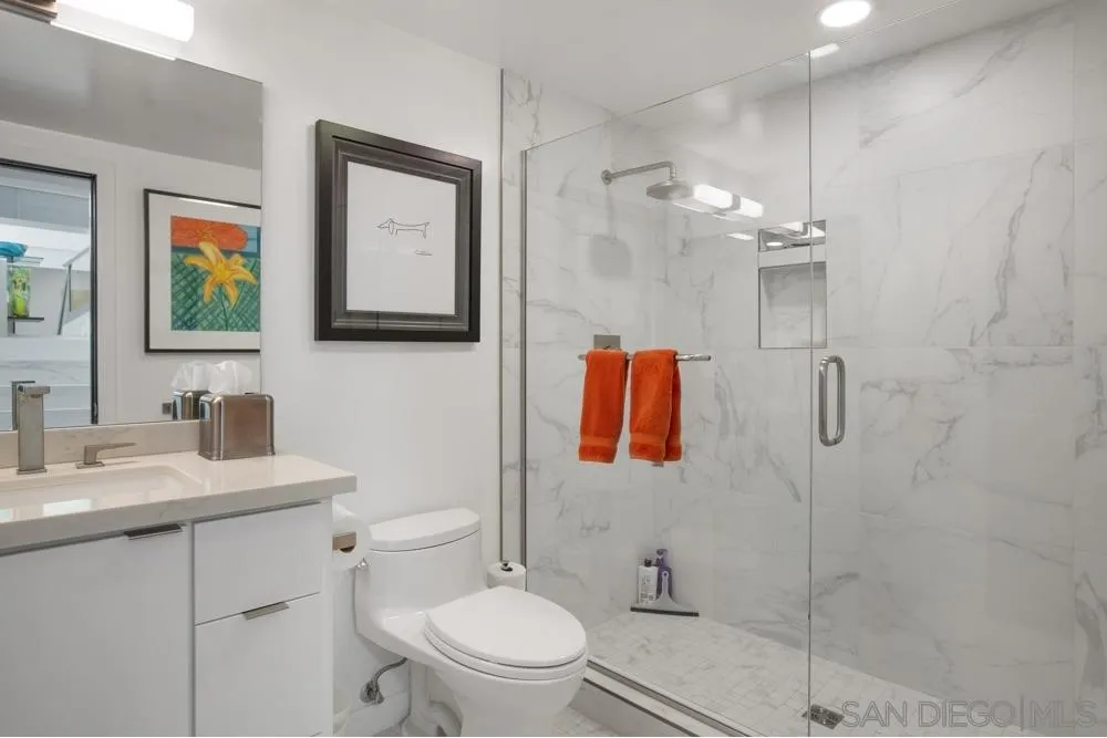 2331 Caringa Way, Unit 38 Carlsbad, CA 92009 - Photo 18 of 26 a bathroom with a toilet sink and shower