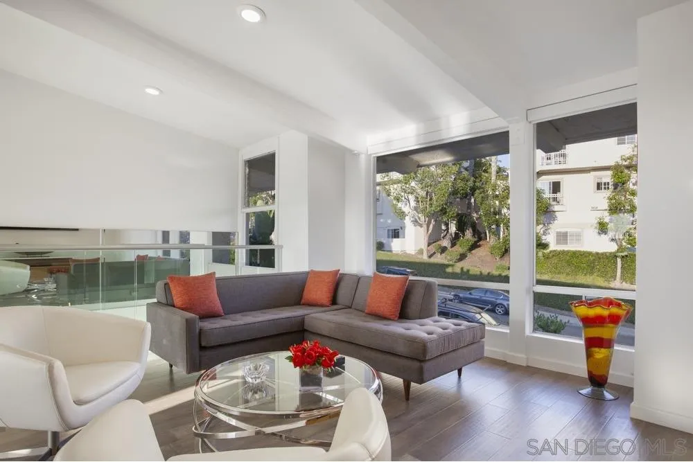 2331 Caringa Way, Unit 38 Carlsbad, CA 92009 - Photo 3 of 26 a living room with furniture and a large window