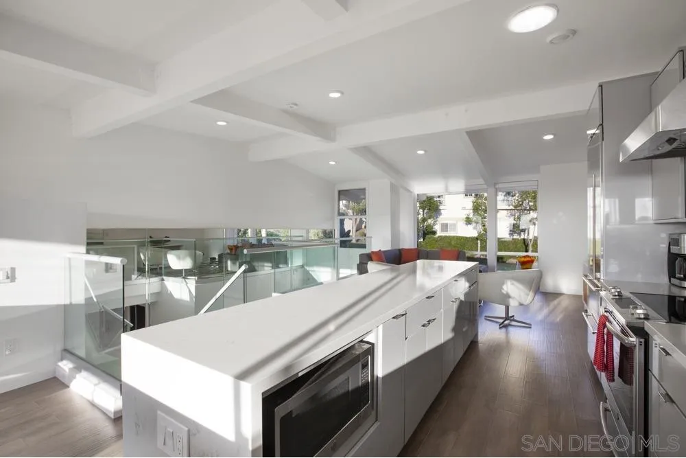 2331 Caringa Way, Unit 38 Carlsbad, CA 92009 - Photo 5 of 26 a large white kitchen with lots of counter top space