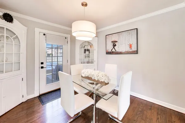 a view of a dining room with furniture and wooden floor