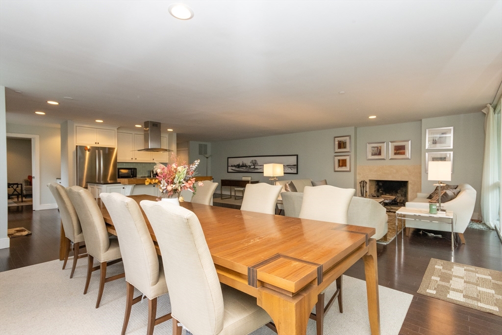 241 Perkins Street, Unit D302 Boston, MA 02130 - Photo 4 of 31 a living room with furniture kitchen view and a wooden floor