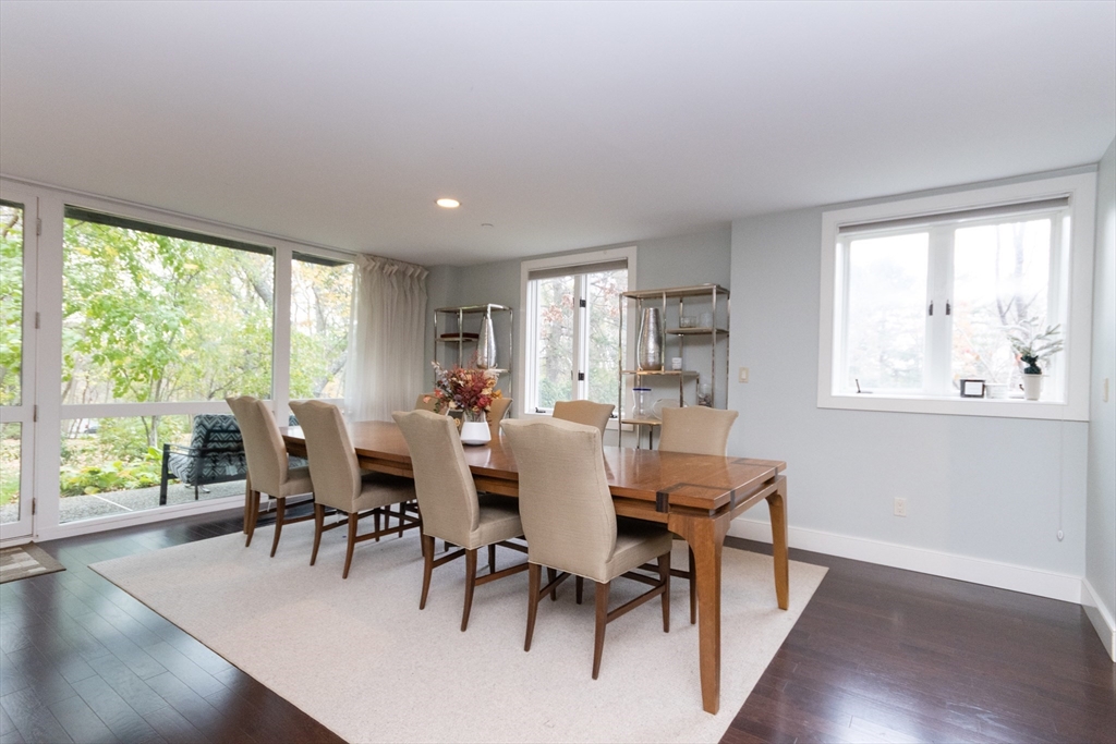 241 Perkins Street, Unit D302 Boston, MA 02130 - Photo 6 of 31 a view of a dining room with furniture window and wooden floor