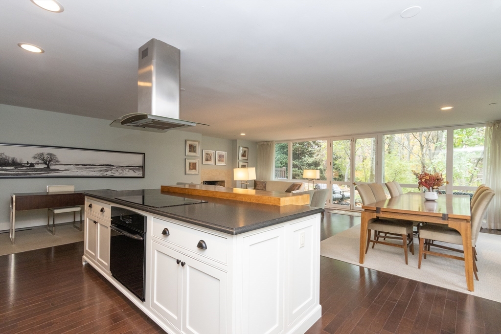 241 Perkins Street, Unit D302 Boston, MA 02130 - Photo 9 of 31 a kitchen with stainless steel appliances granite countertop a stove and a view of living room