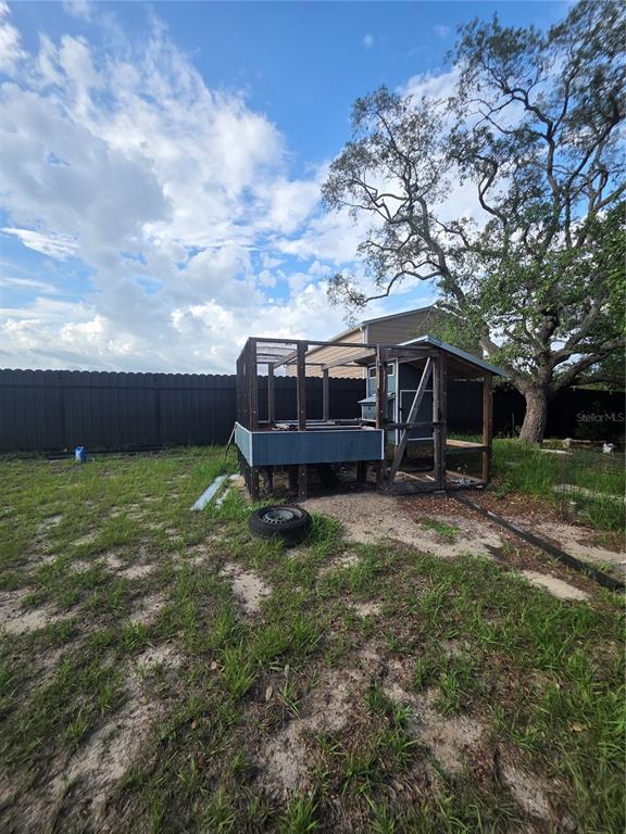 17820 Monteverde Drive Spring Hill, FL 34610 - Photo 37 of 42 a backyard of a house with table and chairs