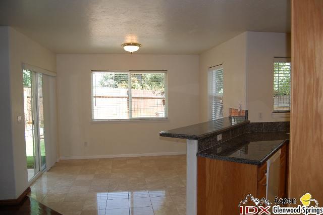 1056 Village Road Carbondale, CO 81623 - Photo 2 of 9 a kitchen that has a sink and a window in it